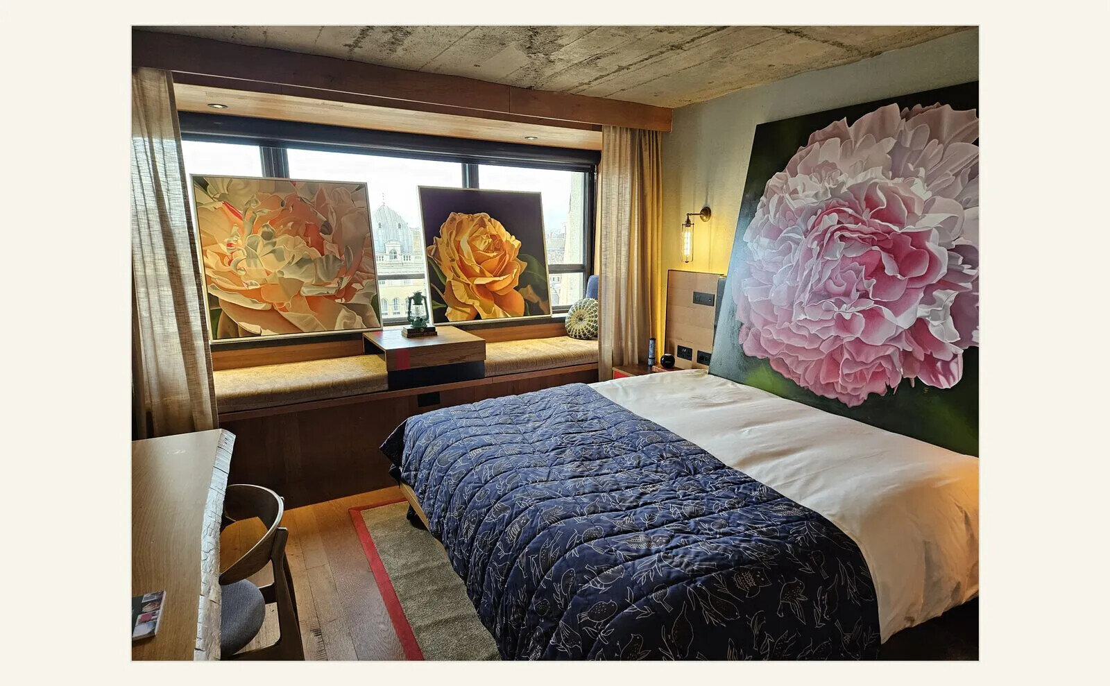 Contemporary artworks installed together in a Treehouse Hotel bedroom.