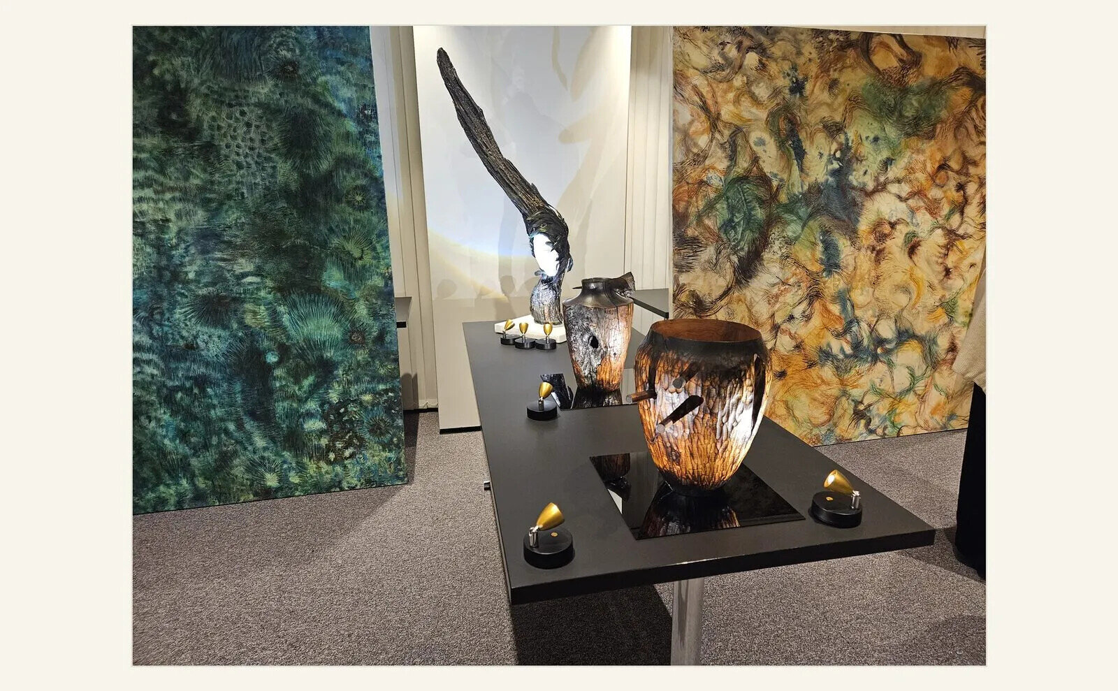 Painting and wood sculpture installed together at a London sustainable art event.
